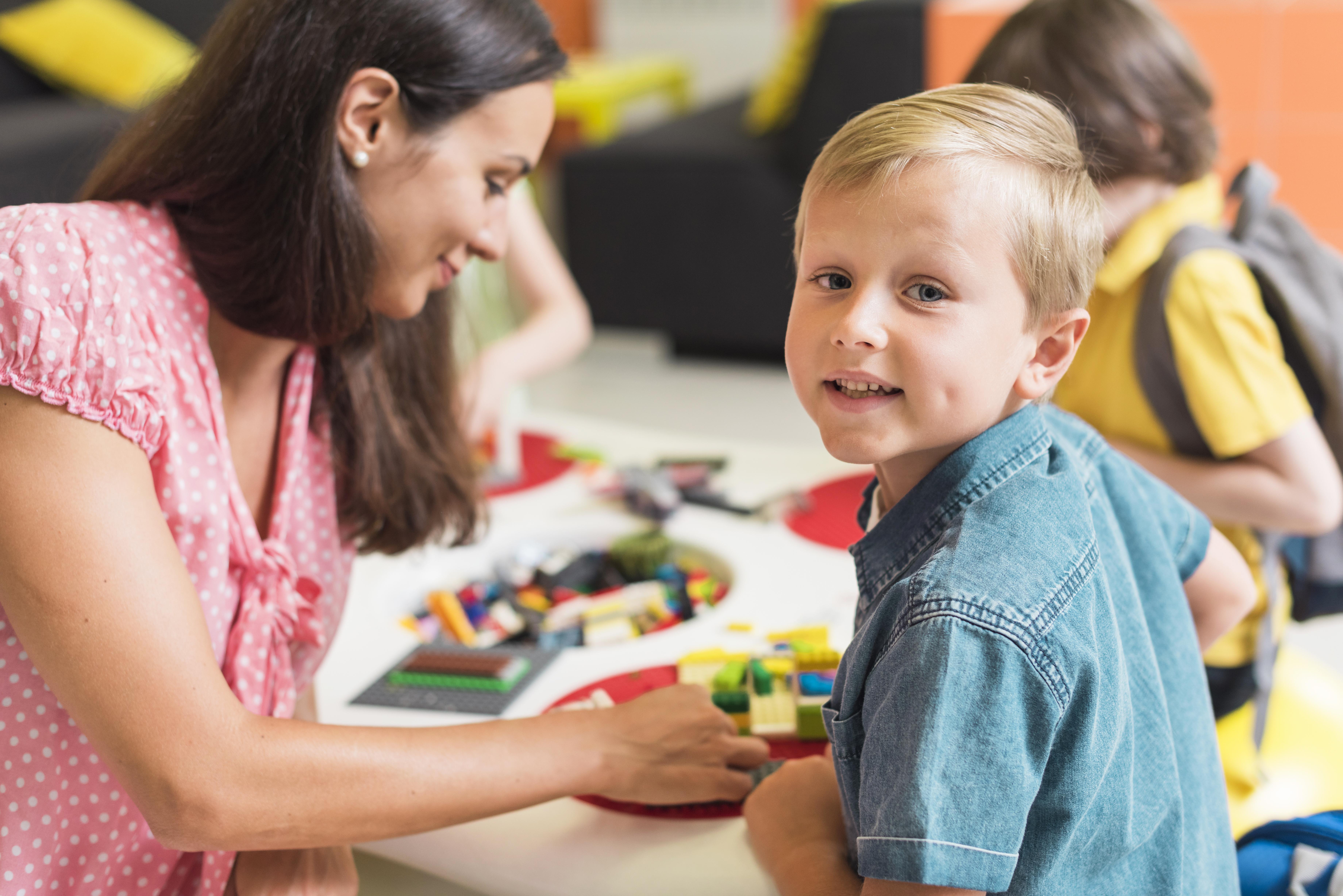 teacher-playing-with-kindergarten-kid.jpg