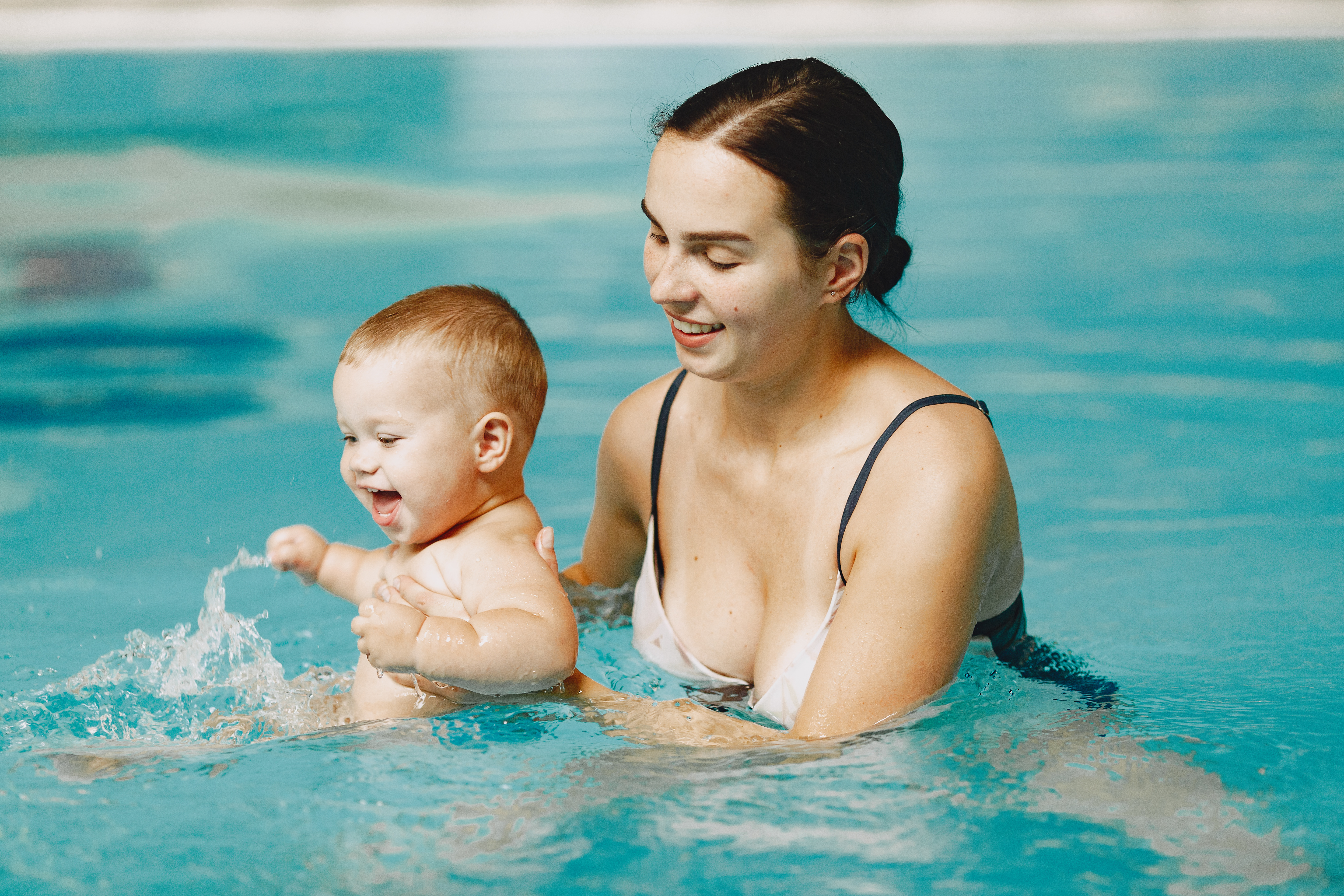 little-cute-baby-boy-mother-with-son-family-playing-in-water.jpg