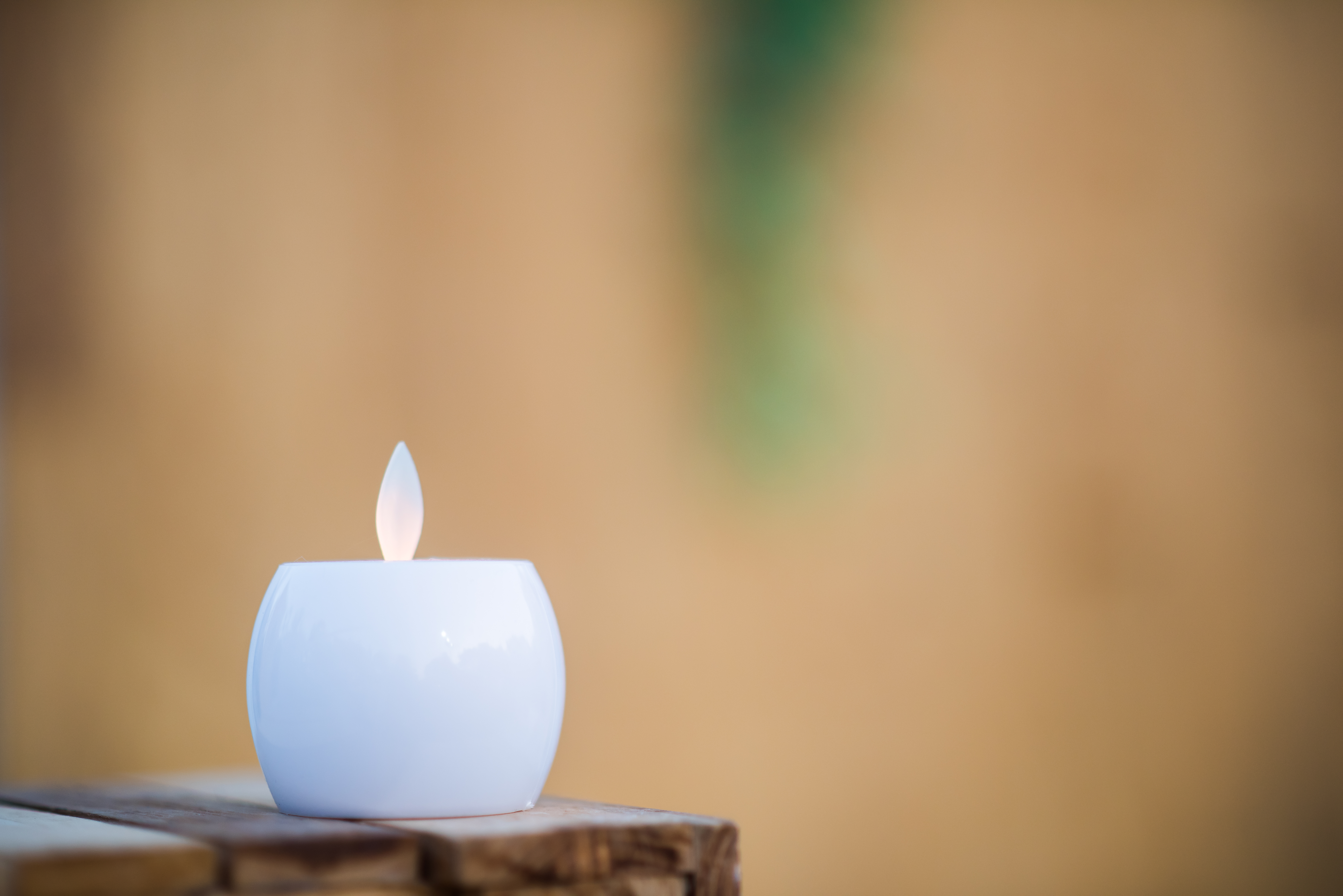 vecteezy_candle-on-wood-table_3485266.jpg