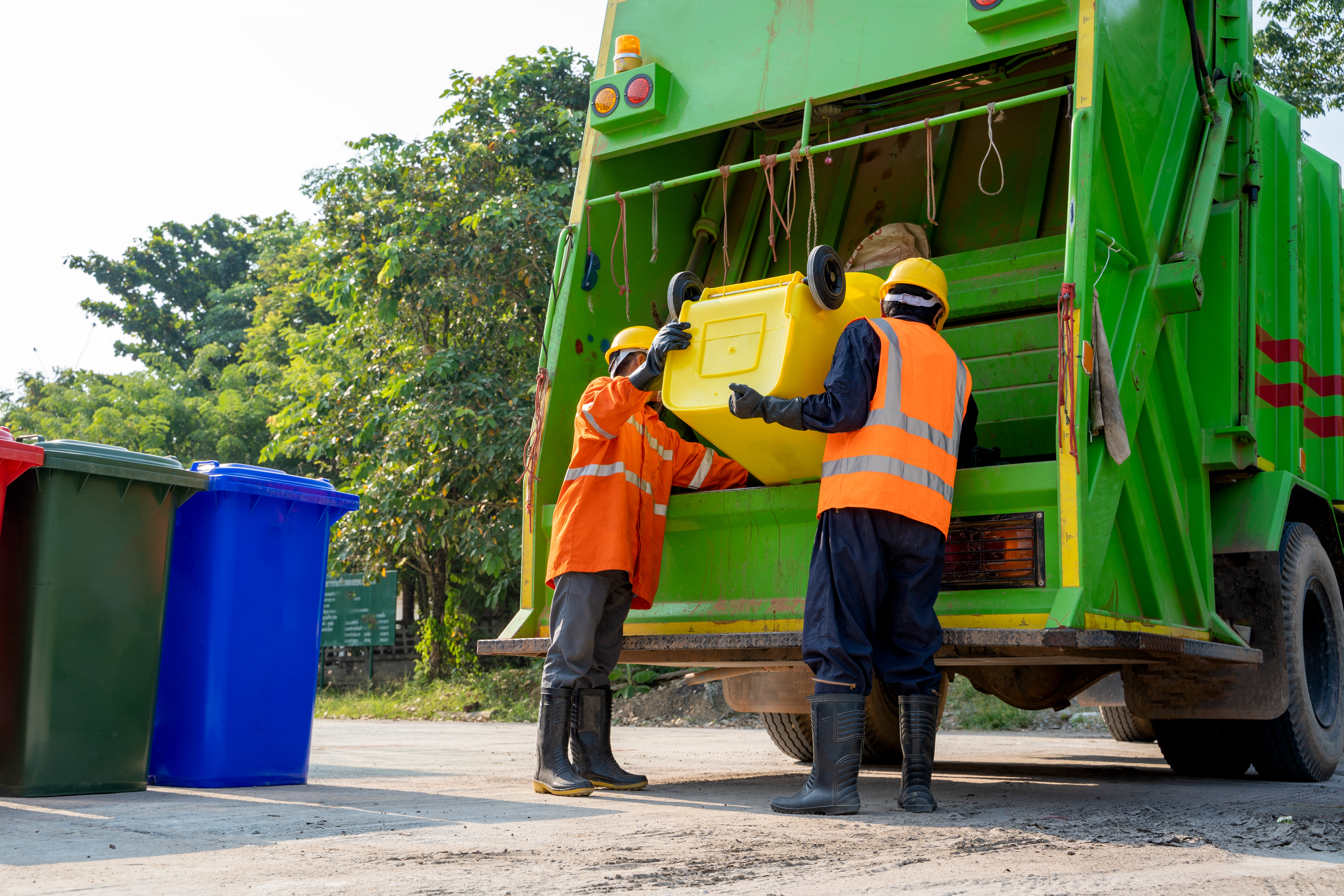 vecteezy_garbage-collectors-with-truck_1229372.jpg