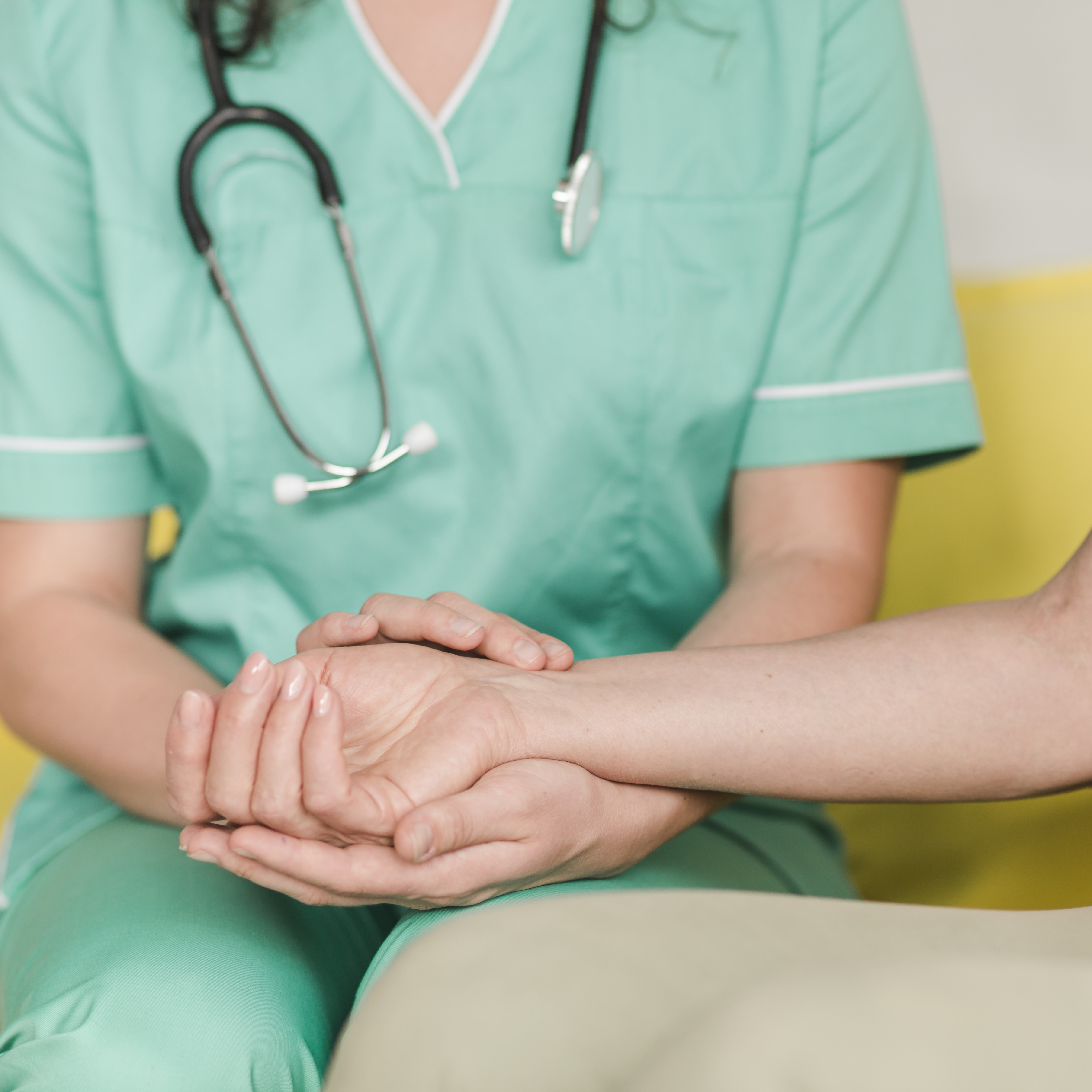 nurse-checking-pulse-female-patient-s-wrist.jpg